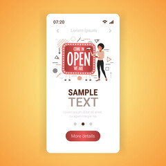 female shop assistant holding shoes near come in we are open board coronavirus quarantine is ending concept smartphone screen mobile app copy space full length vector illustration