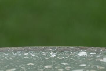 Drop of water on Glass table with raindrop  and blur background with copy space. - 355905433