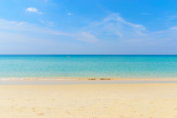Fototapeta na wymiar blue sky background with beach and white sand in Phuket island, Thailand