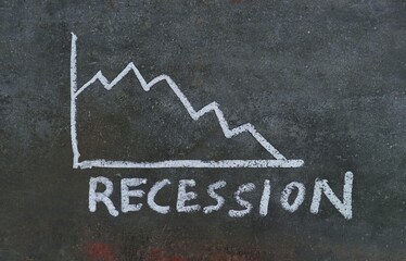 Recession Word Written on Black Surface with White Chalk, Economy Crisis Conceptual Photo