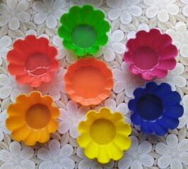 set of colorful muffin forms on table