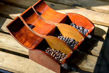 Roasted coffee beans on wooden table background. - 355906056