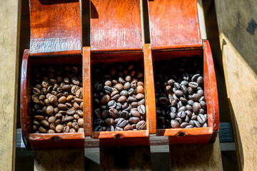 Selective focus of Roasted coffee beans on wooden table background. - 355906095