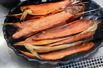 smoked salmon fish on the market shelves. fish for sale in a hypermarket window