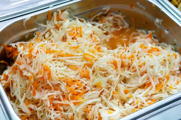 Homemade Sauerkraut with Carrot and Salad Cabbage. Fermented food.