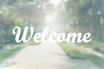 Concept photo of a Welcome doormat. Inscription ''welcome'' on a natural green background