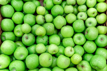 fruit in a supermarket grocery. green apples, sale of ripe fruits