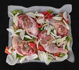 Baked whole chicken drumsticks with potatoes, peppers, onion and peregil.