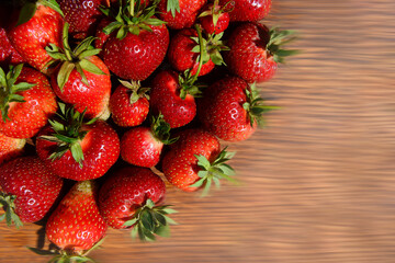 fresh strawberries on a wooden background