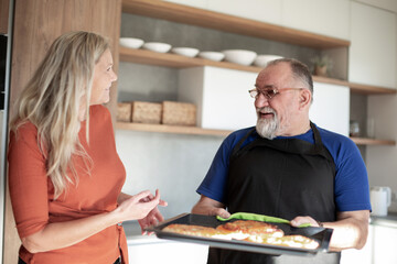 Fototapeta premium husband and wife standing in the kitchen.