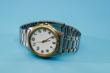 men's wristwatch isolated on a blue background.