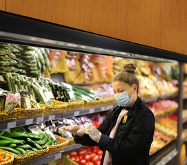 Supermarket shopping, face mask and gloves,Woman buying vegetables at the market	
