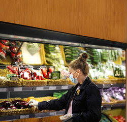 Supermarket shopping, face mask and gloves,Woman buying vegetables at the market	
