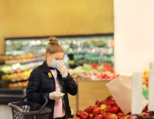 Supermarket shopping, face mask and gloves,Woman buying fruits at the market	