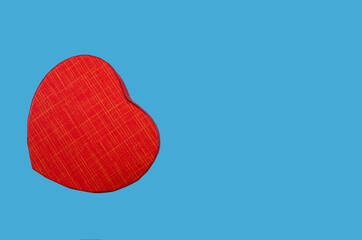 red heart isolated on a blue background. Copy of space. place for text.