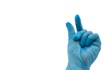 Doctor's hand in sterile medical gloves shows a gesture of 