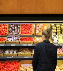Supermarket shopping, face mask and gloves,Woman buying vegetables at the market	
