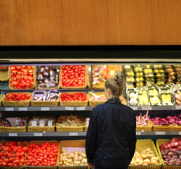 Supermarket shopping, face mask and gloves,Woman buying vegetables at the market	
