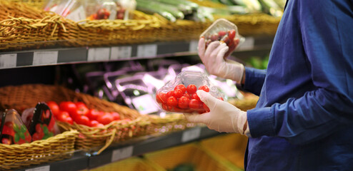 Supermarket shopping, face mask and gloves,man buying tomatoes at the market