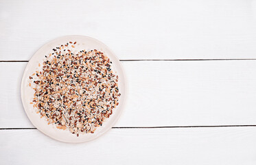 seeds for salad seasoning. seeds to add to a salat or pastry. white background with copy space for text. sesam seeds as source of calcium for health care.