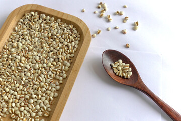 Coix lacryma-jobi in wooden box, closeup of Job's tears, health-preserving food