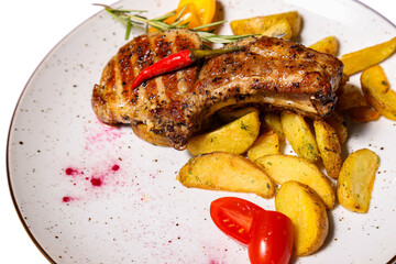 Steak with fried potatoes on white background