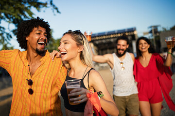 Group of friends having fun, traveling, smiling together outdoors