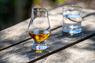 Tasting of scotch single malt whisky from Islay island, most intensely flavoured of all whiskies in Scotland