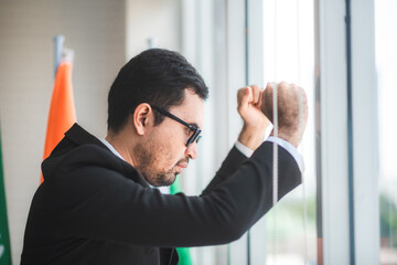 Fototapeta premium businessman failing and serious in office, concept of feeling hopeless, distraught, sad and discouraged in life