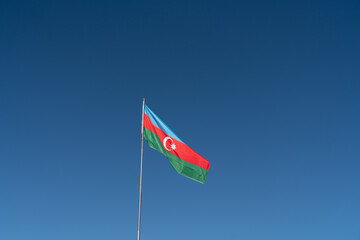 red flag on blue sky