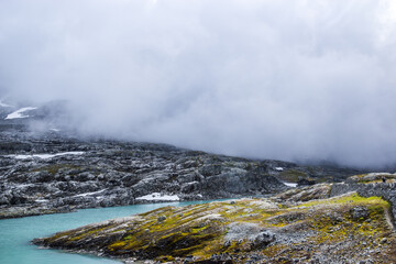 heavy clouds over the lake in the mountains of Norway 