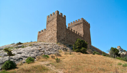 Fototapeta premium Ancient tower on a background of blue sky