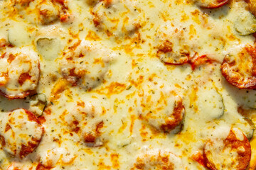 background of hot pizza with cheese top view, texture. homemade food