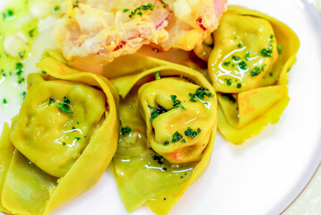 egg and spinach ravioli, stuffed with ricotta and sausage stuffing, seasoned with butter and sage, for the party lunch