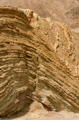 Sandstone rock wall with erosion pattern