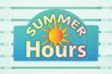 Summer Hours type message with a sun on a green wood sign