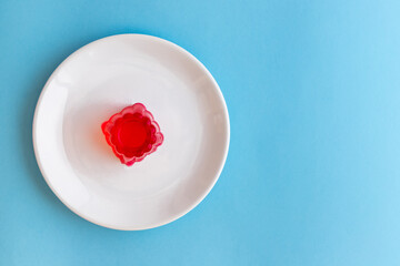 Strawberry jelly on a white plate