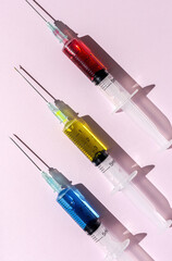 Covid-19- Vaccine vial dose against coronavirus needle syringe, medical concept vaccination