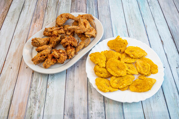 Plate of wings with ripe banana