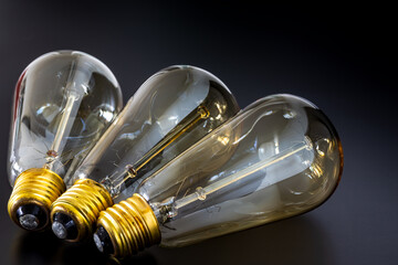 authentic bulbs and yellow bulb bases, electrical foot contact, idea bulb concept wallpaper. golden color 