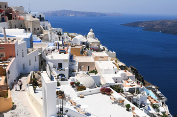 Cityscape of Fira town with white houses and the caldera in Santorini, Greece.