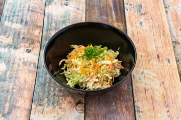 Cabbage salad on wooden table