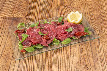Salty meat dish on glass plate