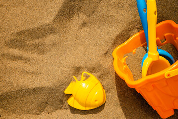 Fototapeta na wymiar Children's plastic beach toys on sand in summer