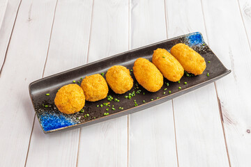 Delicious plate of ration of Spanish croquettes