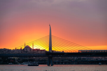 Fototapeta na wymiar Silhouette of Istanbul cityscape with metro bridge and mosque