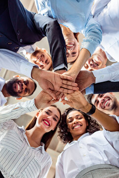 United Business Team Of Colleagues Holding Hands, Bottom View