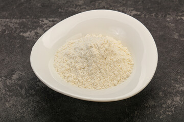 Wheat flour heap in the bowl