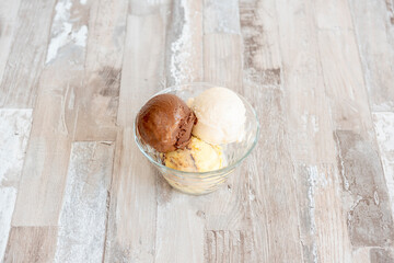 scoops of ice cream in glass cup