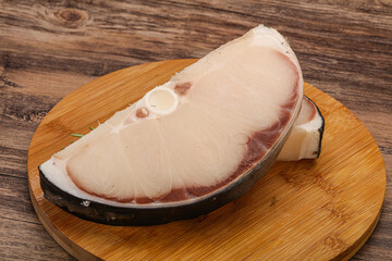 Raw shark steak served rosemary